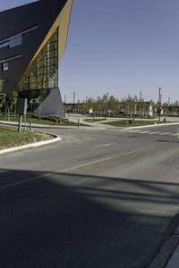 a traffic light with a building in the background and an arrow sign for a school