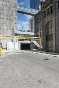 the car has been parked in the parking lot behind the street entrance of the building