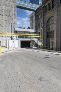 the car has been parked in the parking lot behind the street entrance of the building