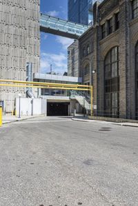 the car has been parked in the parking lot behind the street entrance of the building