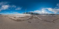 a fish eye view of an empty area with no people around it and snow on the ground