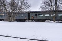 Canada's Winter Industrial Landscape: Snow-Covered Factories and Railroad Tracks