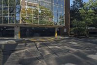 this is a parking garage with a fire hydrant in front of it in an intersection