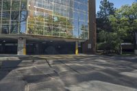 this is a parking garage with a fire hydrant in front of it in an intersection