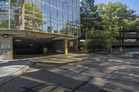 this is a parking garage with a fire hydrant in front of it in an intersection