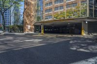 a large parking garage with multiple parking spaces on it's sides along side a street