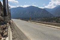 Canadian Highland Road: Surrounded by Nature and Trees with Clouds Above