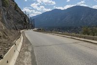 Canadian Highland Road: Surrounded by Nature and Trees with Clouds Above