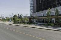 an empty street with a lot of parking and cars on the side of the road