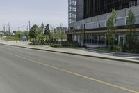 an empty street with a lot of parking and cars on the side of the road