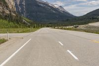 Canadian Landscape: Mountains, Trees, and Clouds