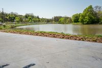 the parking lot with the water behind it is empty and there are no people around