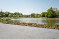 the parking lot with the water behind it is empty and there are no people around