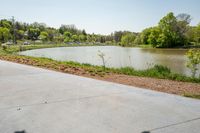 the parking lot with the water behind it is empty and there are no people around