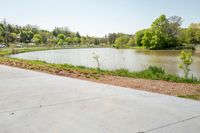 the parking lot with the water behind it is empty and there are no people around