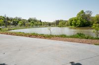 the parking lot with the water behind it is empty and there are no people around