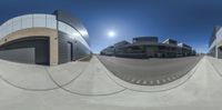 a fisheye photo of an office building in the sun taken in a 360 - view camera