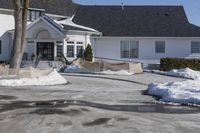 a house with a lot of snow around it and a fire hydrant at the front