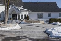 a house with a lot of snow around it and a fire hydrant at the front