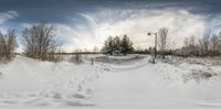 an overhead photo of snow on the ground and in the air, on a camera tripod