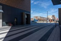 a bicycle is parked outside the building, looking into it from across the street from the sidewalk,