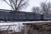 Canadian Train Rolling Down the Railroad Tracks