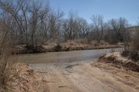 a dirty road that looks very dirty, so people can not cross it as the creek runs into the river