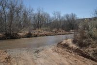 a dirty road that looks very dirty, so people can not cross it as the creek runs into the river