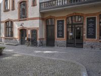 the old townhouse, in sweden is next to an empty cobblestone street