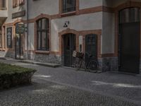 the old townhouse, in sweden is next to an empty cobblestone street