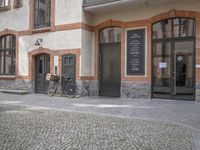 the old townhouse, in sweden is next to an empty cobblestone street