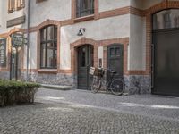 the old townhouse, in sweden is next to an empty cobblestone street