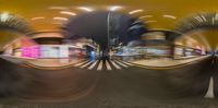 a blurred city with cars going down the street in front of it with buildings behind them