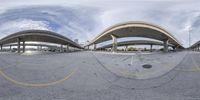 a panoramic photo shows the intersection of a parking lot with two open walkways