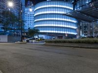 this is a photo of a very large city with skyscrapers at night as well as an urban street