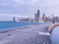 city skyline with the ocean and a path for walking in it by it's water