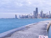 city skyline with the ocean and a path for walking in it by it's water