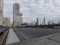 a very wide steel grate street is seen in this image from a low angle