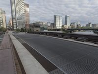 a very wide steel grate street is seen in this image from a low angle