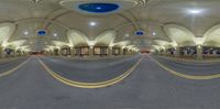 the inside of an old building with vaulted ceiling and curved concrete columns with round windows