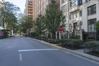 a stop sign is pictured in the middle of an empty street in this town of new york