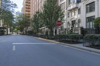 a stop sign is pictured in the middle of an empty street in this town of new york