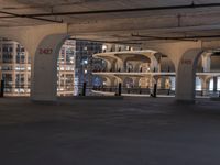 an empty parking lot with lots of windows in the background and a fire hydrant