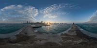 a panoramic view from an outdoor jetty with the city in the distance