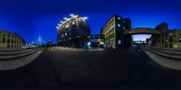 3d photo of an architectural building at night in the city, as seen from a fish eye lens