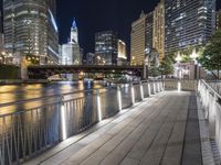 people walking on a bridge near some buildings by the river at night under a full moon