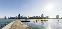 the water is flowing over a pier in chicago's downtown area and into the lake shore