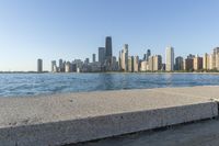 a large body of water with a city skyline behind it in the background's foreground