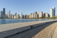 a large body of water with a city skyline behind it in the background's foreground