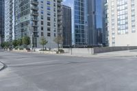 a city filled with lots of tall buildings on top of a gray concrete floor underneath blue sky